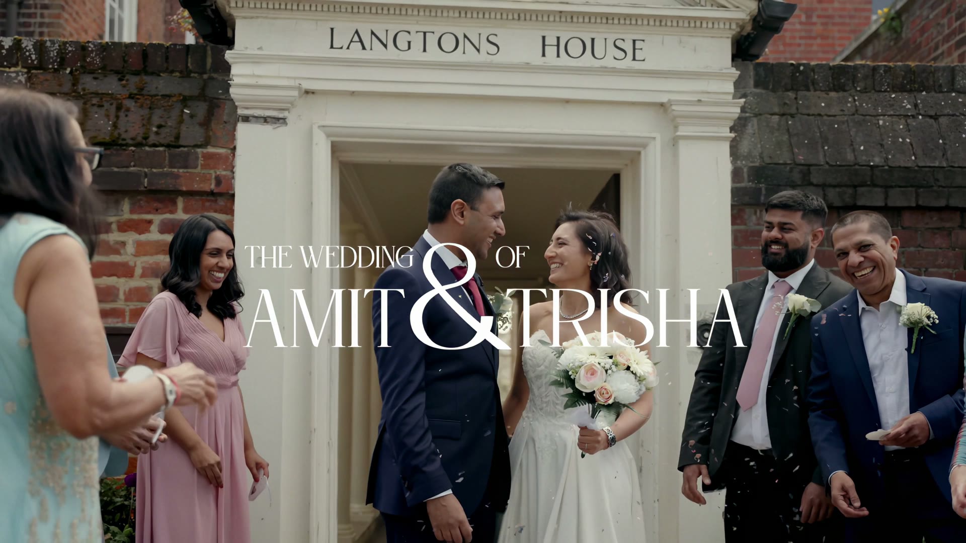 Amit and Trisha under falling confetti outside Langtons House